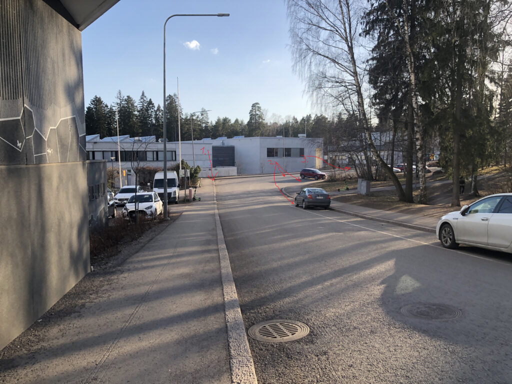Picture of Myllypuro elementary school with guiding arrows.